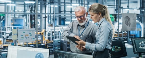 Car,Factory,Office:,Manager,Talks,With,Senior,Engineer,,Use,Tablet